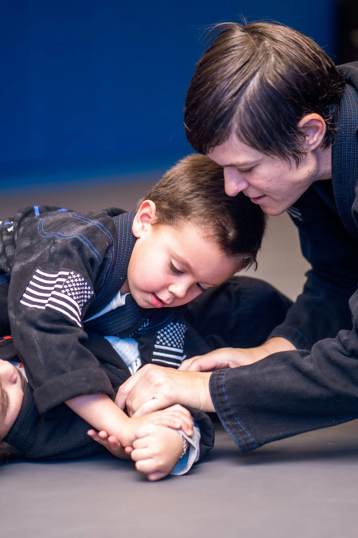 A coach teaching a young student one on one
